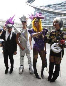 Fans of singer Lady Gaga pose in their outfits before watching the first day concert of Lady Gaga in Manila