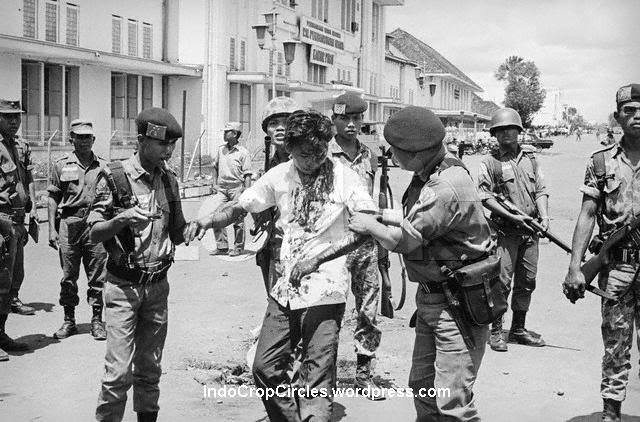 Soldiers rescuing an ethnic-Chinese youth from the mob, 1966